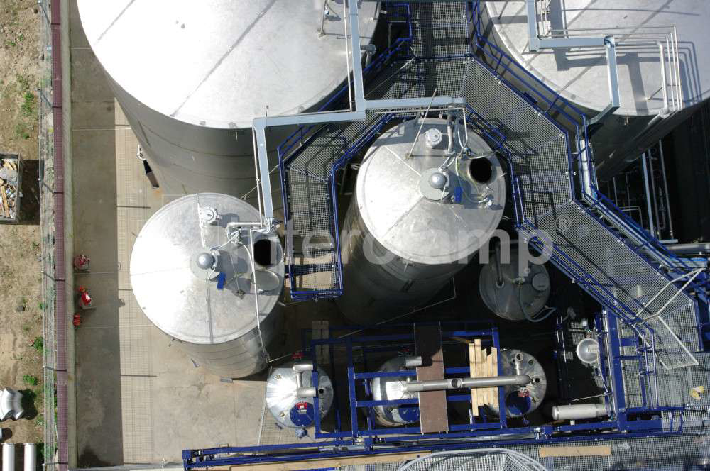 Close-up of Interclamp tube clamp fittings forming a sturdy safety guardrail along a chemical plant walkway, ensuring the safety of personnel.